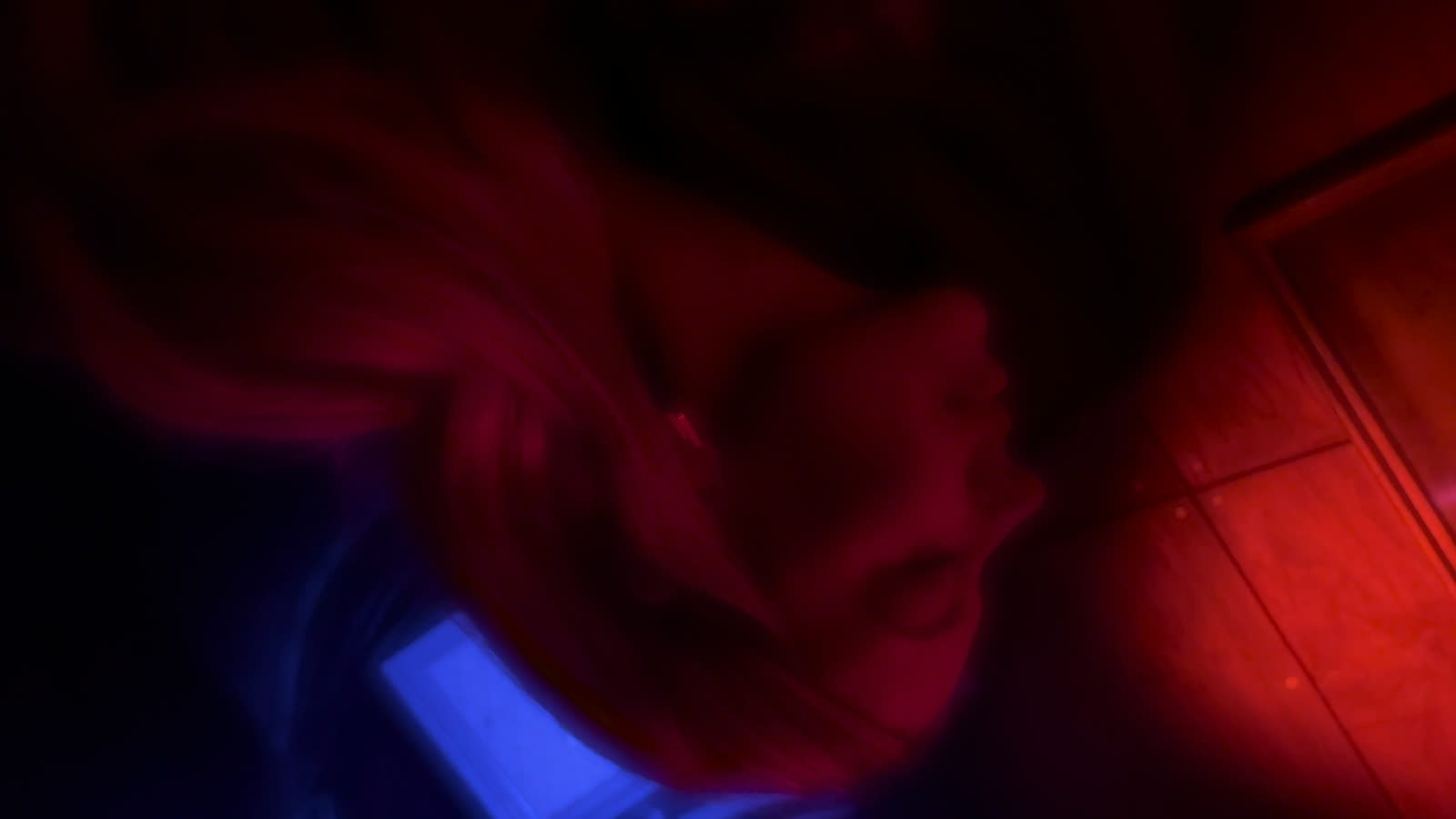 Face in red and blue light